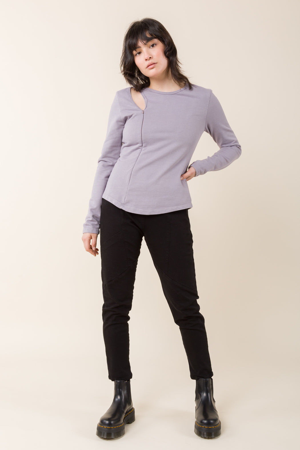 The Tendril Sweater employs multiple necklines to appear as layers, exposing the clavicle. The softness and ease of a sweatshirt with a minimal, futuristic appearance.