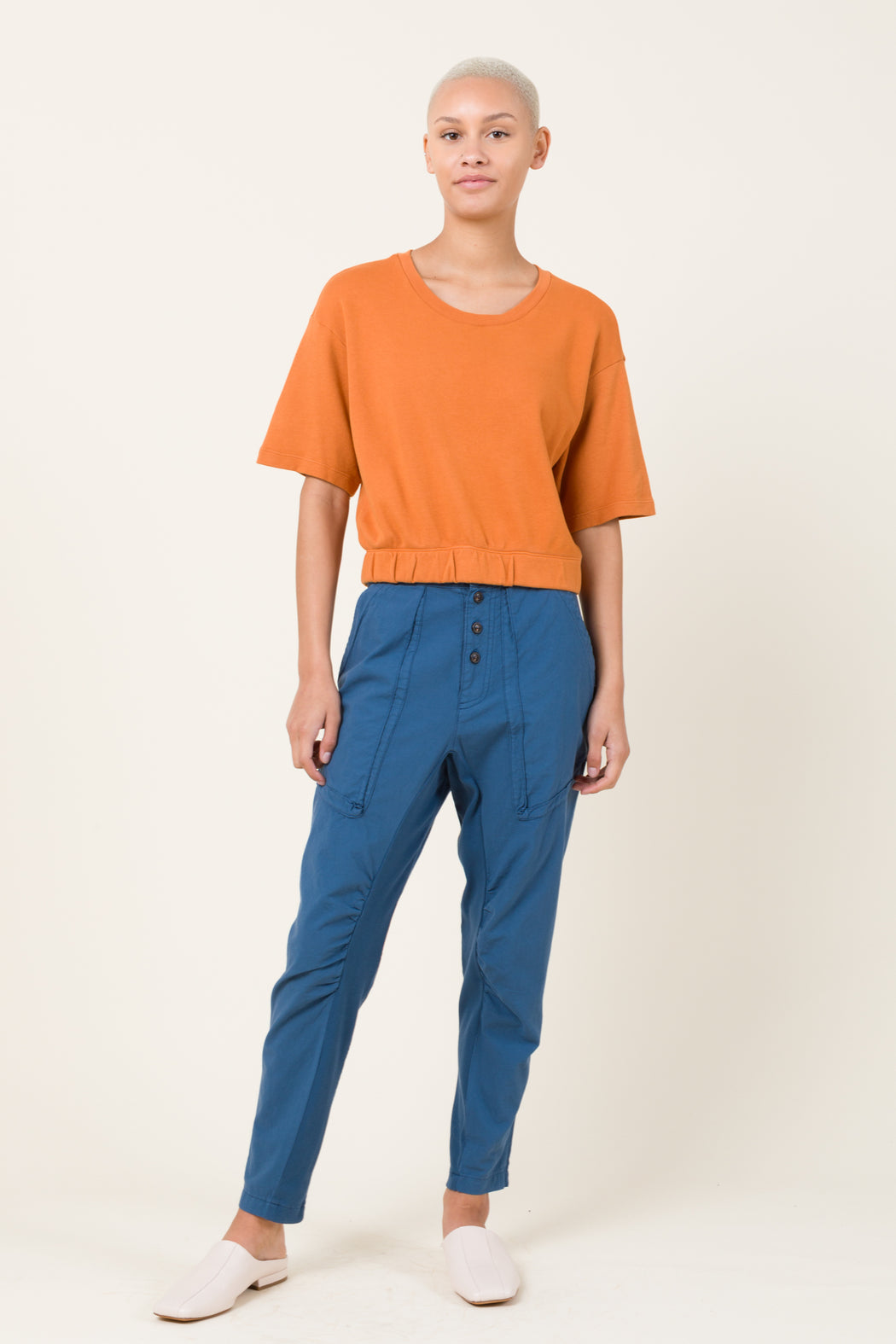 An incredibly soft, relaxed, lightweight pant with an organic cotton muslin body has an organic cotton knit inset at the inseam for style and comfort. A mid-rise, exposed button fly pant with deep gusseted front pockets, back patch pockets and belt loops.The softened cotton will loosen with wear, the initial fit should be snug.