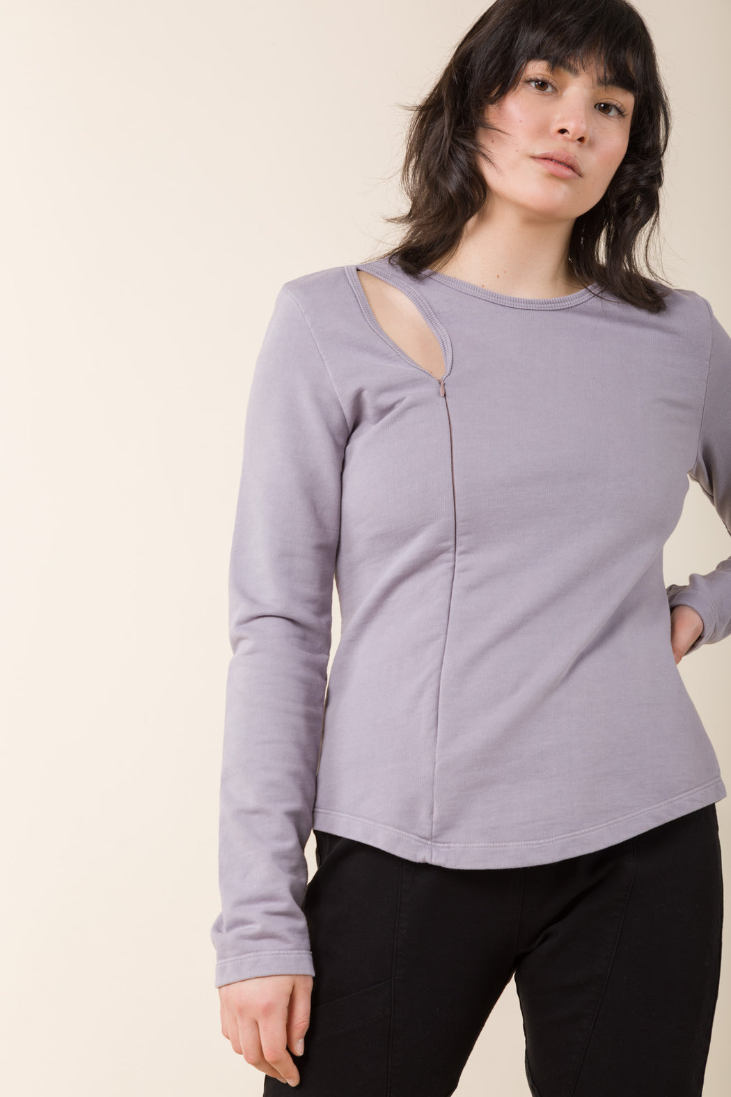 The Tendril Sweater employs multiple necklines to appear as layers, exposing the clavicle. The softness and ease of a sweatshirt with a minimal, futuristic appearance. 
