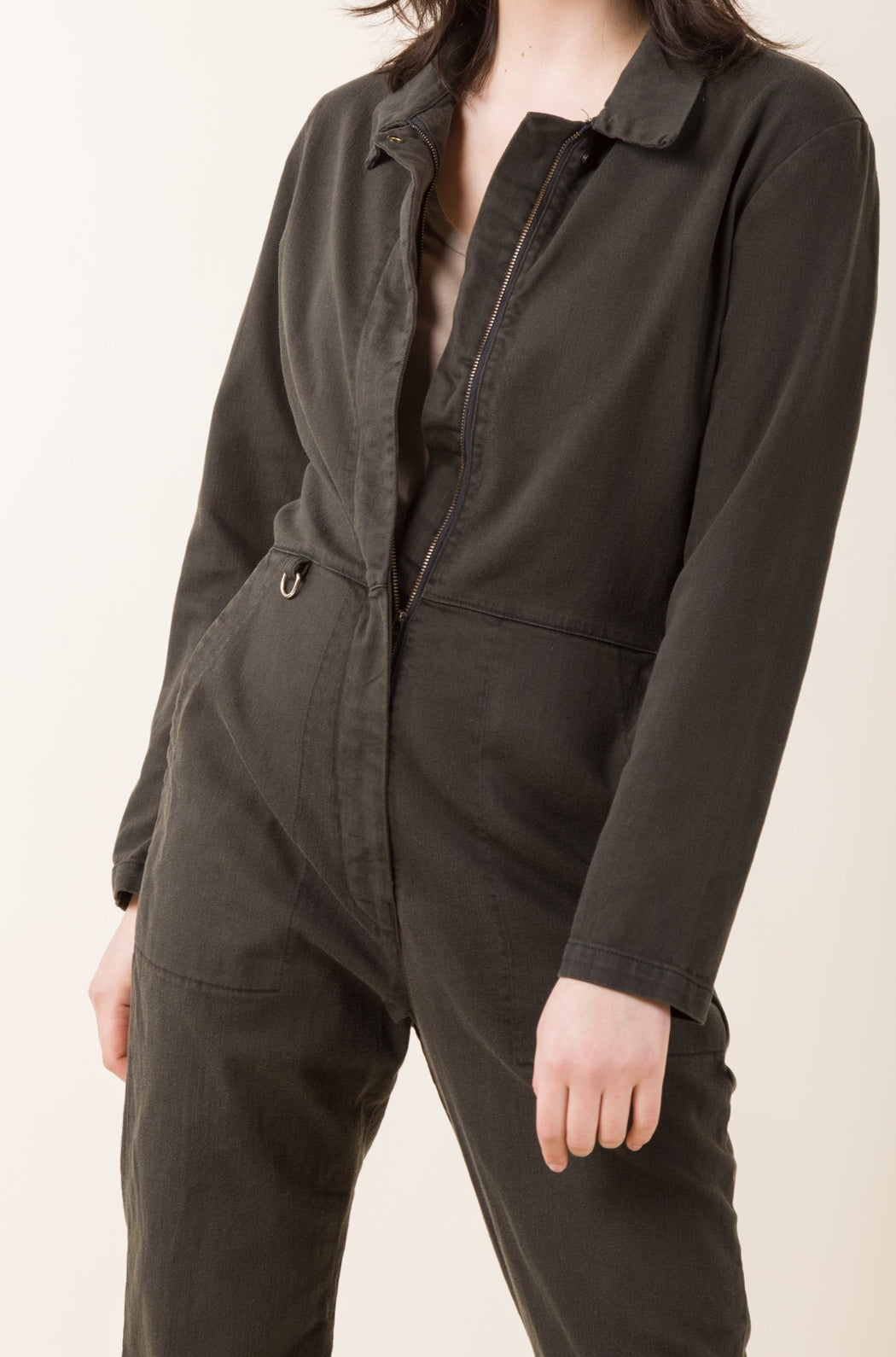 This version of our Denim Coveralls is nipped and darted with a high waist and fitted hip. Bulletproof luxury that is ready for anything, we stripped back details to create the perfect basic coverall.